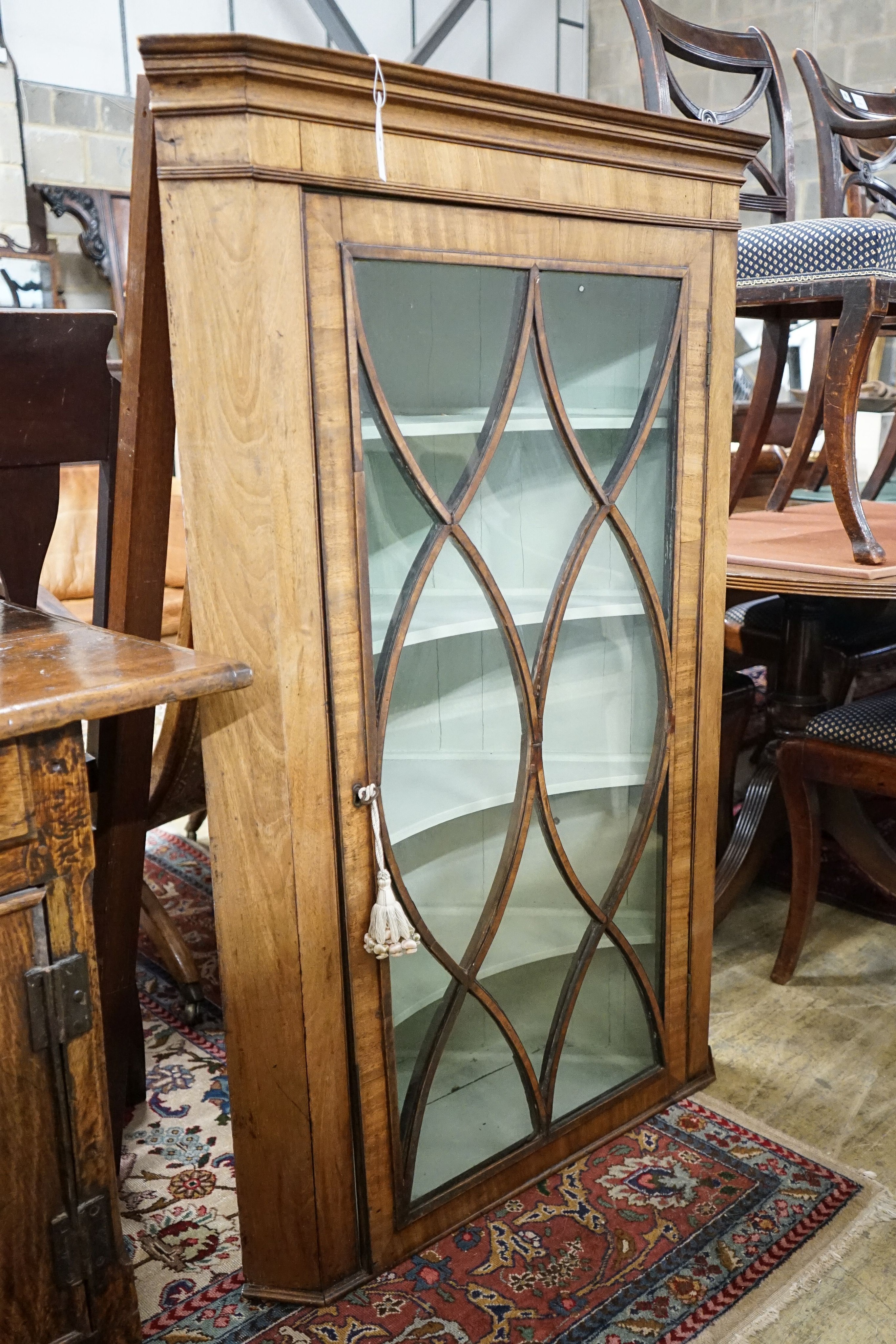 A George III mahogany hanging corner cabinet, width 82cm, depth 46cm, height 127cm